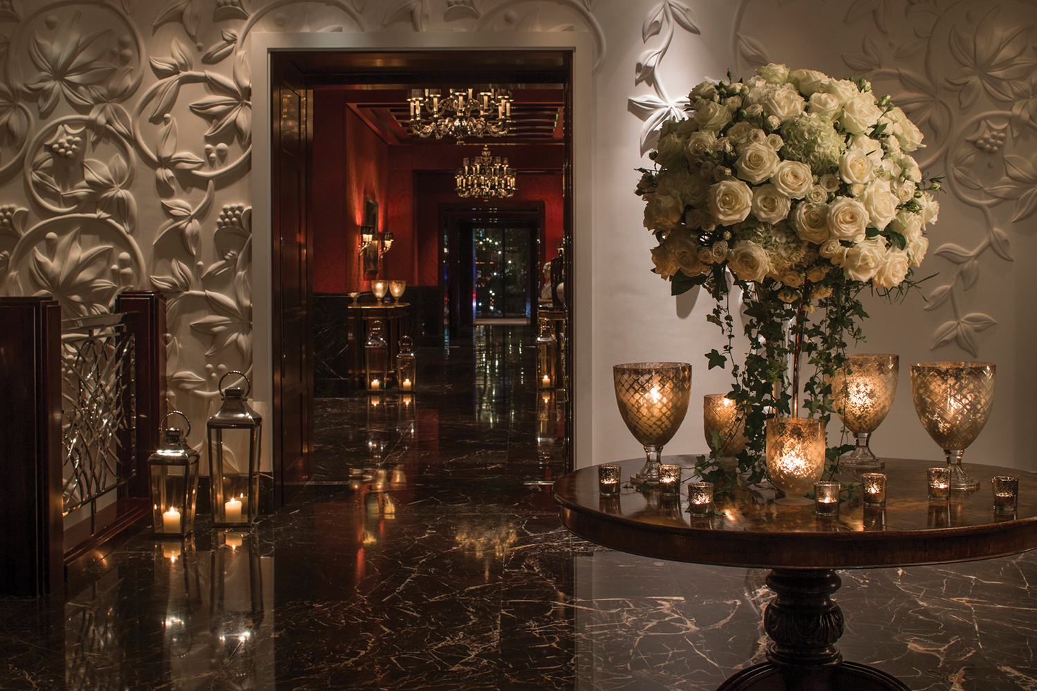 Four Seasons Table and Candles leading into another room elegant.