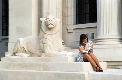 saturday_26th_may_2018_7.40pm_-_woman_reading_next_to_lion.jpg