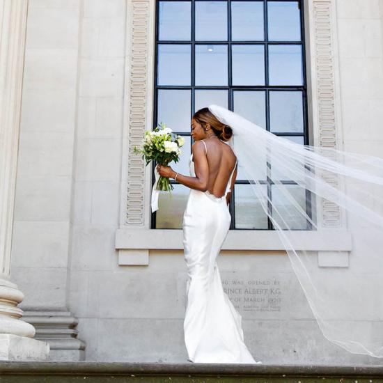 Bride standing in front of the Town Hall